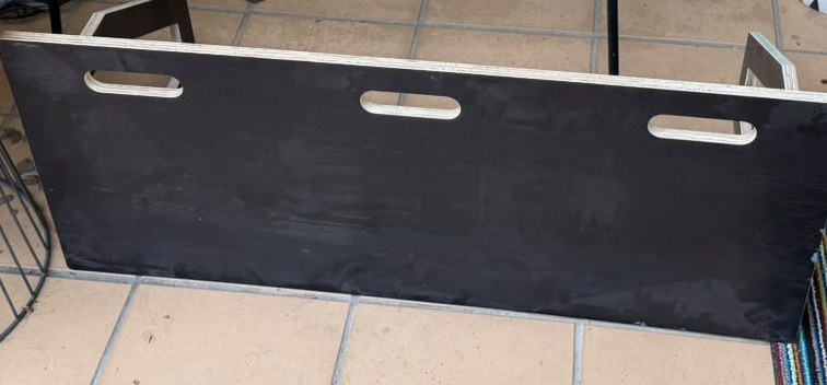 Black plywood soccer rebounder board with carry handles